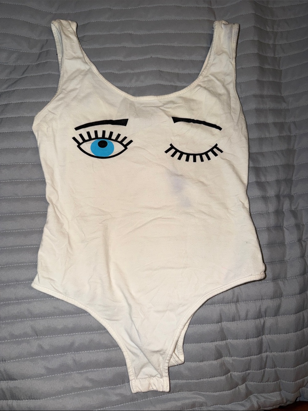 White One-Piece Bodysuit with Winking Eye Print